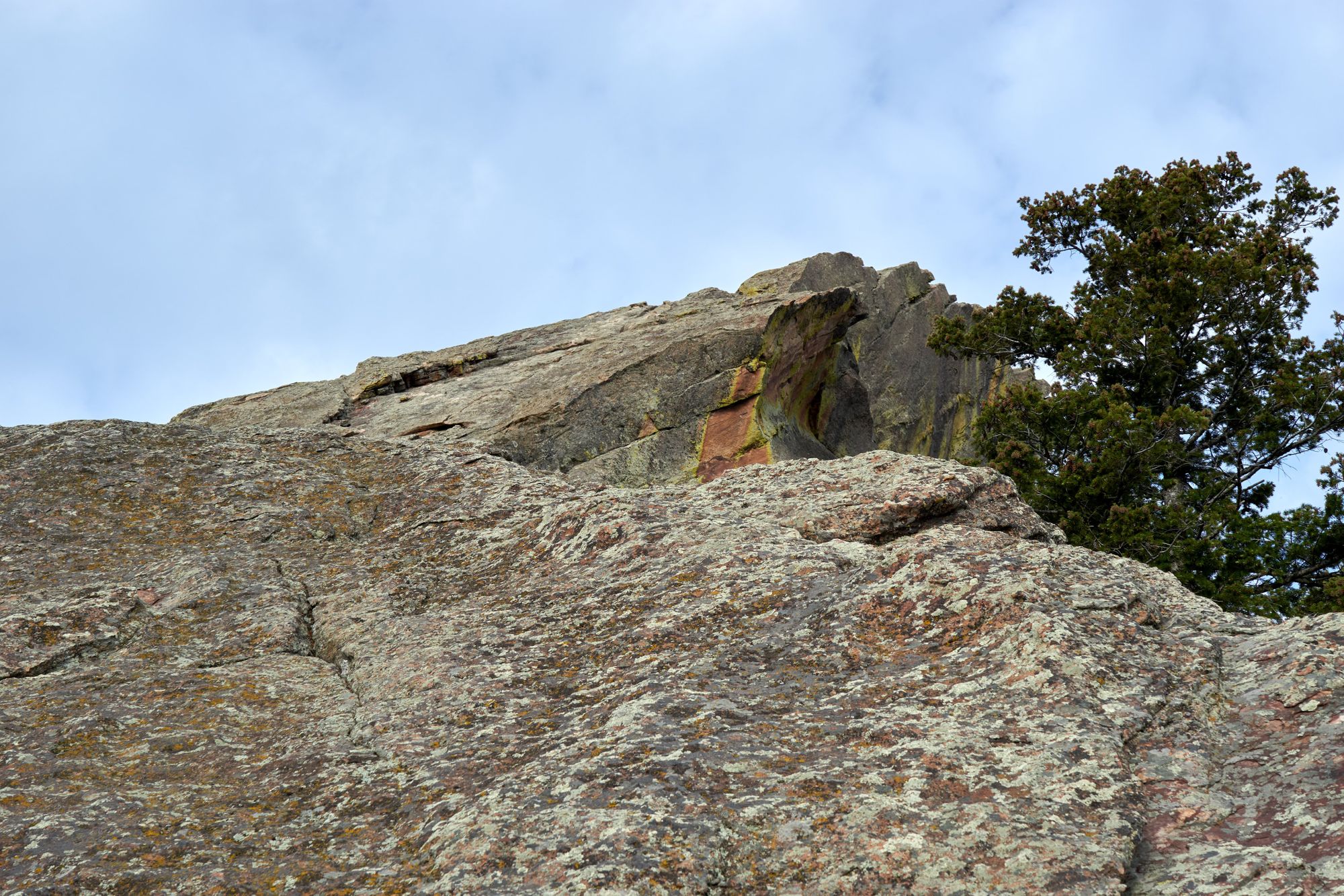 Looking up at a gently sloped rock climb.